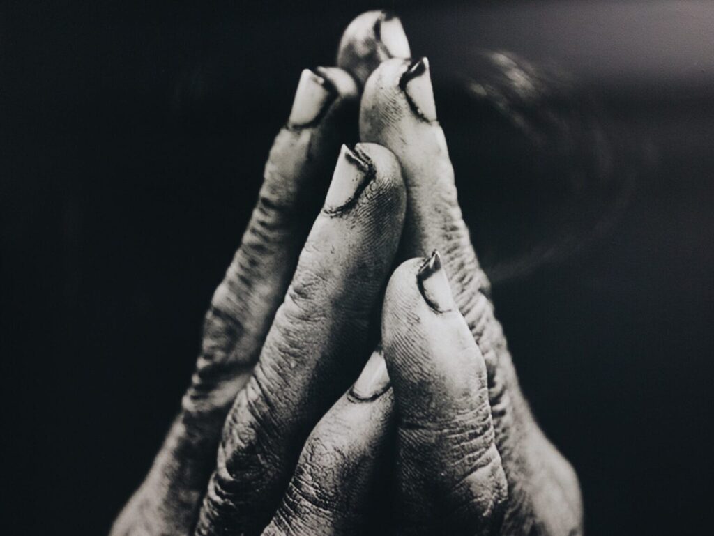 Two hands pushed together in a prayer position